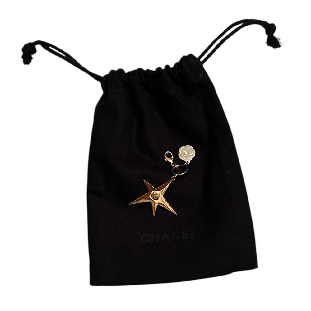 Chanel Gold Star & Small Camellia Key Charm With Black Drawstring Pouch.